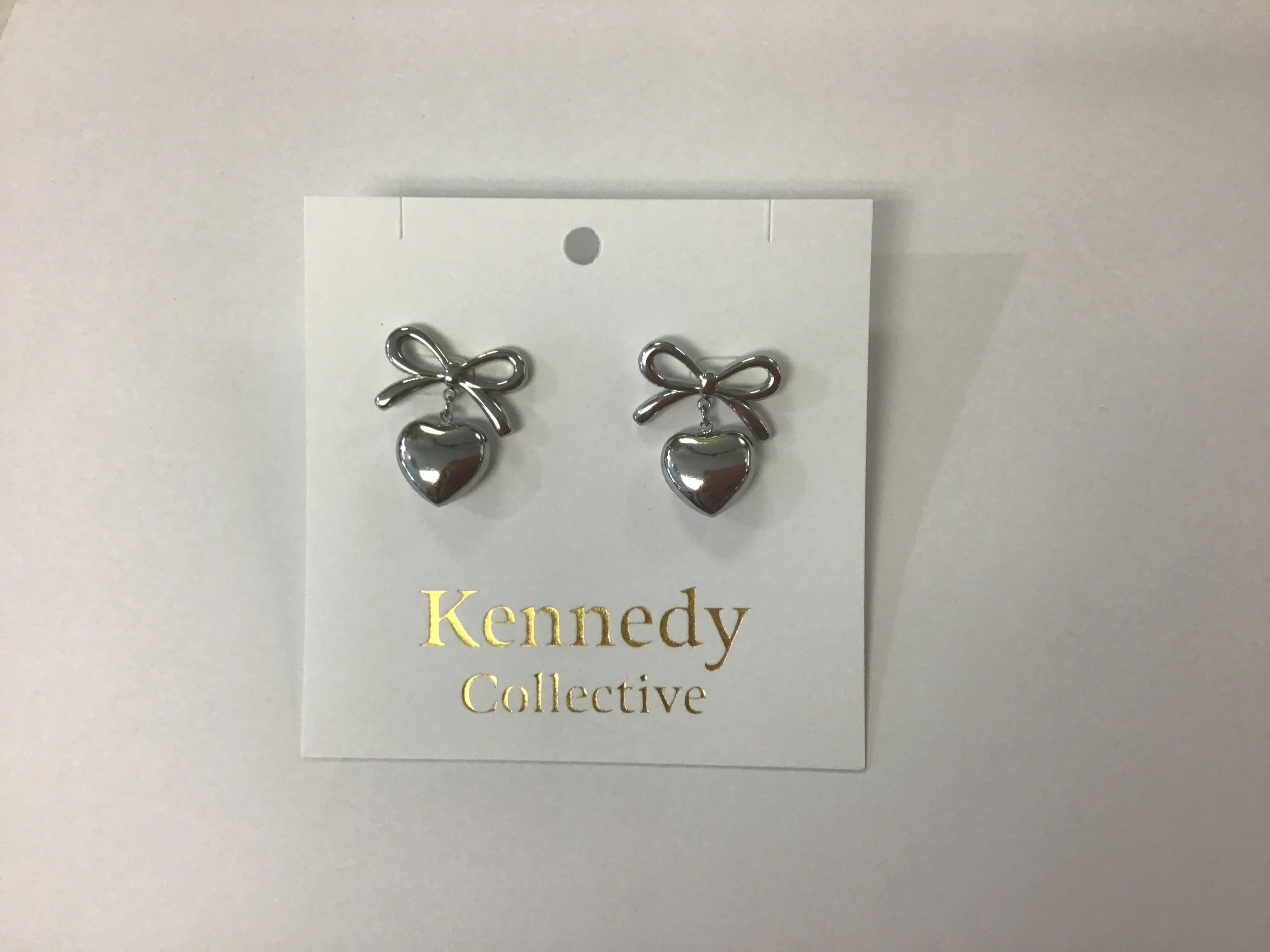 Silver bow heart stud